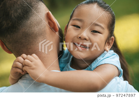 Cute little asian girl with father looking happy 97247897