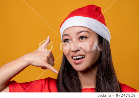 Cute happy young woman in red speaking on air phone 97247928