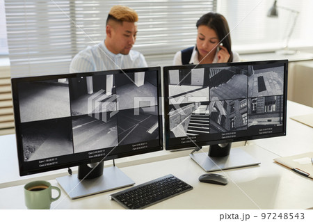 Background image two computer screens with multiple surveillance camera feeds Background image two computer screens with multiple surveillance camera feeds 97248543