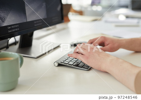 Close up young woman typing on keyboard 97248546