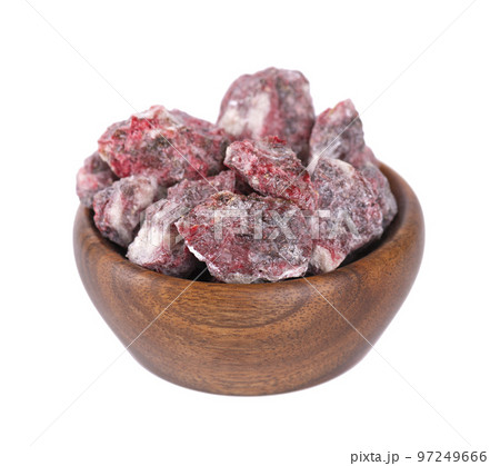Benzoin Siam resinoid in wooden bowl, isolated on white background. Mix of benzoin and Dammar resin. Tropical resins. Top view. 97249666