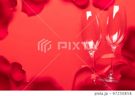 Valentines day card with champagne glasses and rose petals 97250858