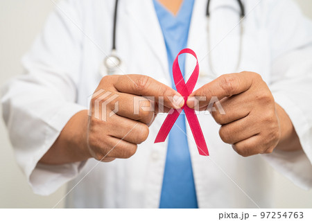 Breast cancer, Asian doctor woman with pink ribbon, symbol of World Breast Cancer Day. Breast cancer, Asian doctor woman with pink ribbon, symbol of World Breast Cancer Day. 97254763