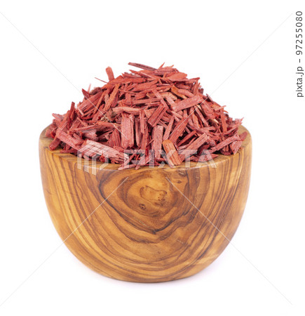 Red Sandalwood incense chips in wooden bowl, isolated on white background. Sanderswood, rubywood or red saunders. 97255080