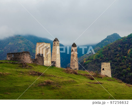 Majestic battle towers of Ingushetia. Historical monument, tourist attraction. Medieval tower complex Erzi, one of the largest medieval castle-type tower villages. Majestic battle towers of Ingushetia. Historical monument, tourist attraction. Medieval tower complex Erzi, one of the largest medieval castle-type tower villages. 97256632