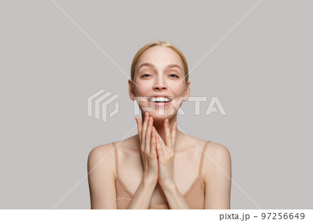 Young female face. Cute blonde woman with clear fresh skin on white background 97256649