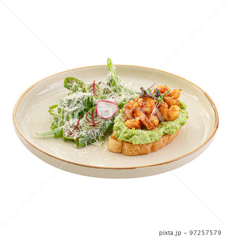 Portion of avocado toast with shrimp and salad 97257579