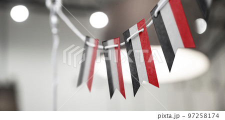 A garland of Yemen national flags on an abstract blurred background A garland of Yemen national flags on an abstract blurred background 97258174