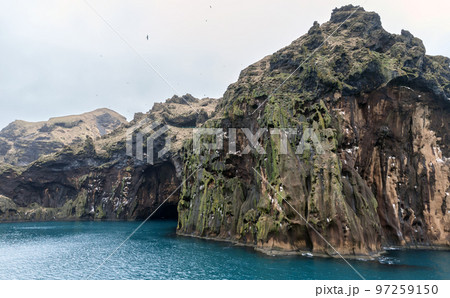 Rocky coasts of the Vestmannaeyjar island, Iceland Rocky coasts of the Vestmannaeyjar island, Iceland 97259150