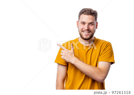 Smiling man pointing on copyspace 97261318