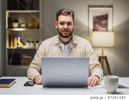 Businessman with laptop portrait 97261385