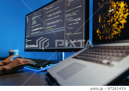 No face image of male hands typing on keyboard, writing html code for website on pc No face image of male hands typing on keyboard, writing html code for website on pc 97261459