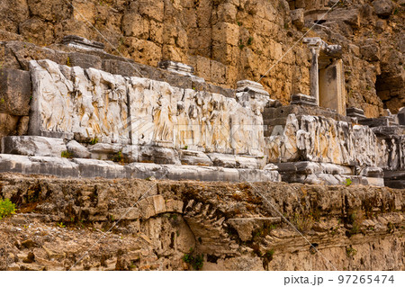 Remains of ornamental reliefs decorating skene of Roman theater in Perge, Turkey Remains of ornamental reliefs decorating skene of Roman theater in Perge, Turkey 97265474