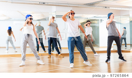 Boy and girls having dancing class 97265864