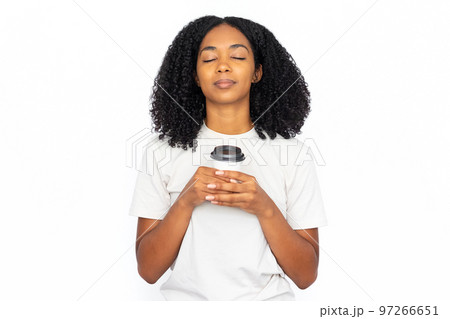 Pleased multiracial woman with cup of coffee Pleased multiracial woman with cup of coffee 97266651