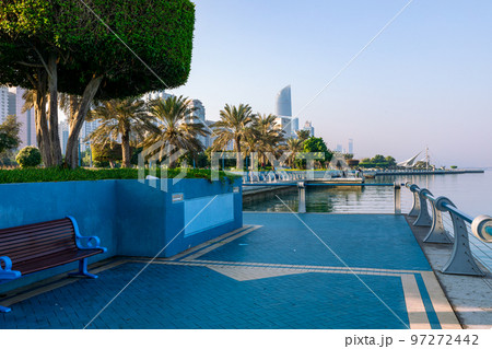 Abu Dhabi Skyline from Corniche. Abu Dhabi, Modern Skyscrapers and Landmark. Promenade in Abu Dhabi. United Arab Emirates, Middle East.  97272442