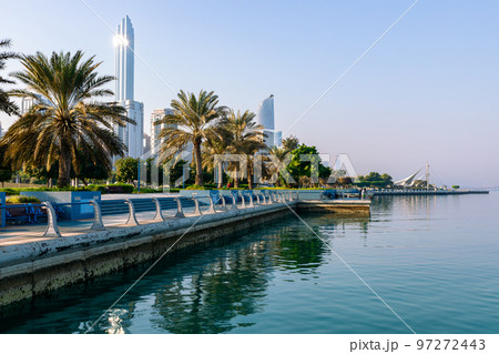 Abu Dhabi Skyline from Corniche. Abu Dhabi, Modern Skyscrapers and Landmark. Promenade in Abu Dhabi. United Arab Emirates, Middle East. Abu Dhabi Skyline from Corniche. Abu Dhabi, Modern Skyscrapers and Landmark. Promenade in Abu Dhabi. United Arab Emirates, Middle East. 97272443