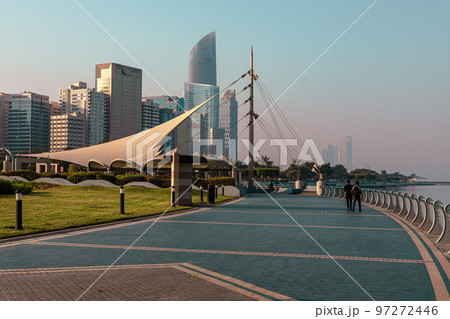 Abu Dhabi Skyline from Corniche. Abu Dhabi, Modern Skyscrapers and Landmark. Promenade in Abu Dhabi. United Arab Emirates, Middle East. Abu Dhabi Skyline from Corniche. Abu Dhabi, Modern Skyscrapers and Landmark. Promenade in Abu Dhabi. United Arab Emirates, Middle East. 97272446