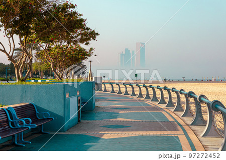 Abu Dhabi Skyline from Corniche. Abu Dhabi, Modern Skyscrapers and Landmark. Promenade in Abu Dhabi. United Arab Emirates, Middle East. Abu Dhabi Skyline from Corniche. Abu Dhabi, Modern Skyscrapers and Landmark. Promenade in Abu Dhabi. United Arab Emirates, Middle East. 97272452