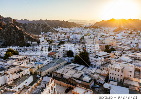 Mutrah Sunset. Cityscape View of Muscat at Beautiful Sunset. The Capital of Oman. Arabian Peninsula. Mutrah Sunset. Cityscape View of Muscat at Beautiful Sunset. The Capital of Oman. Arabian Peninsula. 97273721