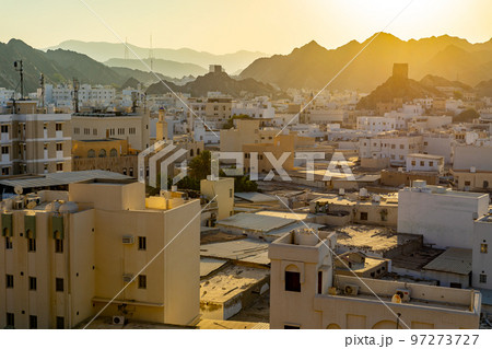 Mutrah Sunset. Cityscape View of Muscat at Beautiful Sunset. The Capital of Oman. Arabian Peninsula. Mutrah Sunset. Cityscape View of Muscat at Beautiful Sunset. The Capital of Oman. Arabian Peninsula. 97273727