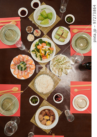 Traditional dishes served for Tet family dinner, view from above Traditional dishes served for Tet family dinner, view from above 97273864