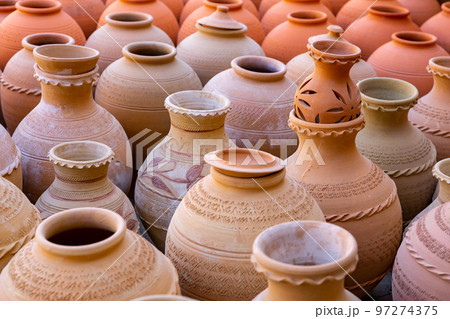 Hand Made Pottery in Nizwa Market. Clay Jars at the Rural Traditional Arabic Bazaar, Oman. Hand Made Pottery in Nizwa Market. Clay Jars at the Rural Traditional Arabic Bazaar, Oman. 97274375