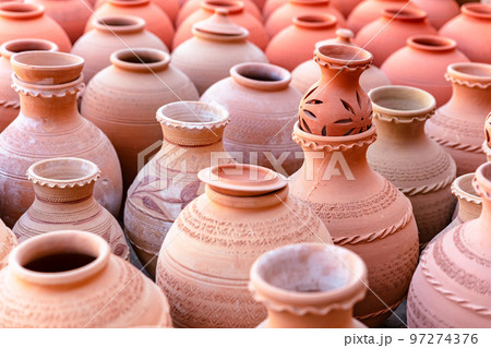 Hand Made Pottery in Nizwa Market. Clay Jars at the Rural Traditional Arabic Bazaar, Oman. Hand Made Pottery in Nizwa Market. Clay Jars at the Rural Traditional Arabic Bazaar, Oman. 97274376