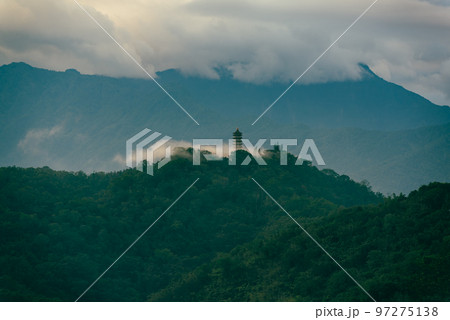 The temple on the mountain was covered by early morning clouds. The temple on the mountain was covered by early morning clouds. 97275138