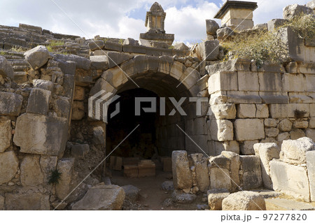 Ancient city of Xanthos in turkey. Stone columns with decoration and decor. Ruins of ancient Greek civilization, stone objects of culture and art. 97277820