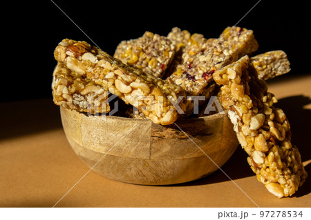 Homemade Granola energy bar. Variety of homemade protein granola breakfast bars with nuts, raisins dried cherries and chocolate. Healthy nutrition eating Gluten free cereal dieting snack super food Homemade Granola energy bar. Variety of homemade protein granola breakfast bars with nuts, raisins dried cherries and chocolate. Healthy nutrition eating Gluten free cereal dieting snack super food 97278534