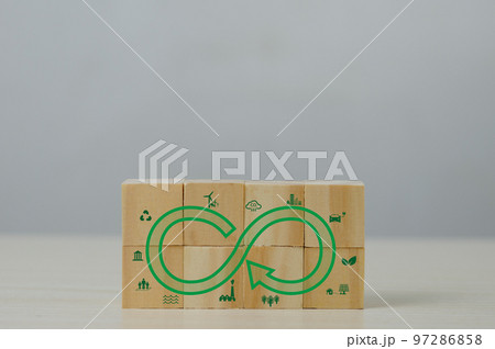 Net zero green eco infinity technology innovation eco carbon renewable energy sustainable development business Circular Economy concept with wood cube blocks. Net zero green eco infinity technology innovation eco carbon renewable energy sustainable development business Circular Economy concept with wood cube blocks. 97286858