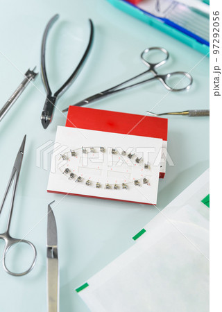 Orthodontic typodont with metal braces and mini screws tooth extraction treatment 97292056