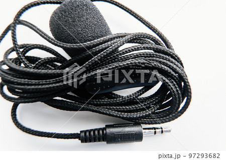 Buttonhole on a white background. Compact microphone for audio recording. 97293682