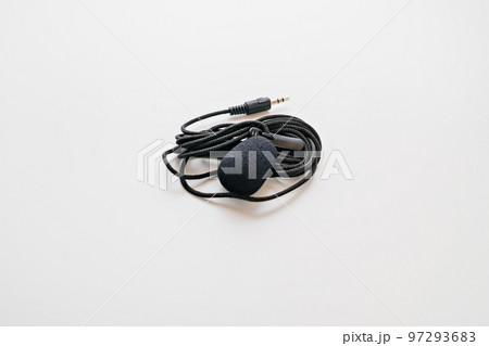 Buttonhole on a white background. Compact microphone for audio recording. 97293683