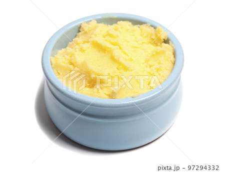 Ghee in a butter dish isolate on a white background Ghee in a butter dish isolate on a white background 97294332