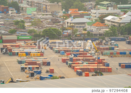 Aerial view of container cargo ship in the export and import business and logistics international goods in urban city. Shipping to the harbour by crane in Bangkok harbour, Thailand. Aerial view of container cargo ship in the export and import business and logistics international goods in urban city. Shipping to the harbour by crane in Bangkok harbour, Thailand. 97294408