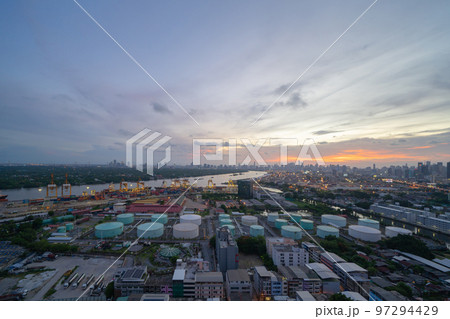 Aerial view of container cargo ship in the export and import business and logistics international goods in urban city. Shipping to the harbour by crane in Bangkok harbour, Thailand. 97294429