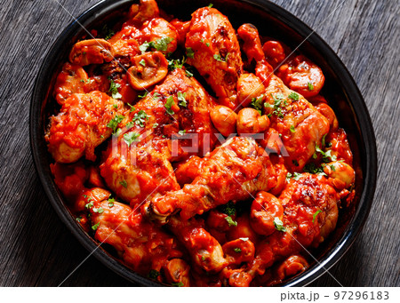 chicken stew with mushrooms in a tomato sauce chicken stew with mushrooms in a tomato sauce 97296183