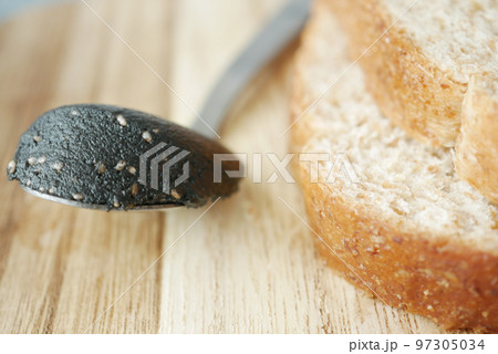Black sesame spread on a bread Black sesame spread on a bread 97305034