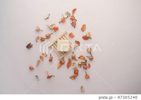 overhead view of Homemade natural soap bar and dry flowe overhead view of Homemade natural soap bar and dry flowe 97305240