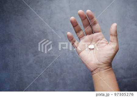 top view of man hand holding pills with copy space  97305276