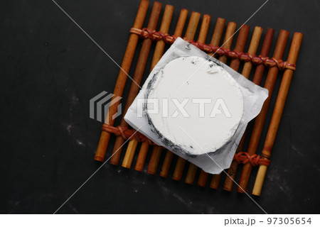 fresh goat cheese and grape fruit on wooden background. 97305654