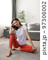 Happy woman resting after workout 97306002
