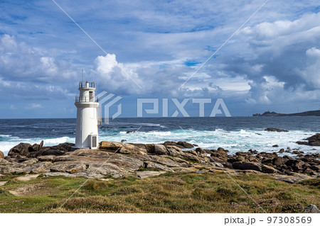 Lighthouse in Muxia on the Costa da Morte in Galicia, Spain. Cape Vilan in the background 97308569