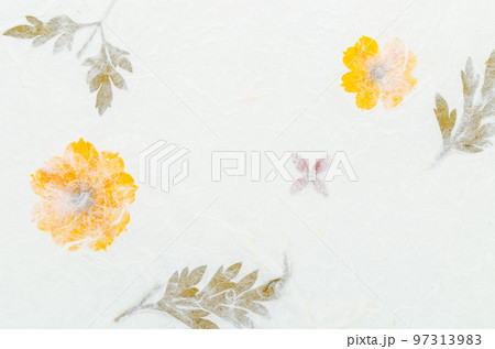 The Handmade recycled flower and leaf paper background. The Handmade recycled flower and leaf paper background. 97313983