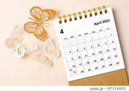 A April 2023 desk calendar for the organizer to plan and reminder and butterfly paer on yellow background. A April 2023 desk calendar for the organizer to plan and reminder and butterfly paer on yellow background. 97314003