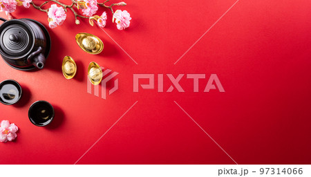 Chinese new year decorations made from red packet, orange and gold ingots or golden lump on a red background. Chinese characters FU in the article refer to fortune good luck, wealth, money flow. Chinese new year decorations made from red packet, orange and gold ingots or golden lump on a red background. Chinese characters FU in the article refer to fortune good luck, wealth, money flow. 97314066