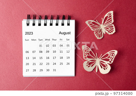 A August 2023 desk calendar for the organizer to plan and reminder with paer butterfly on red background. 97314080