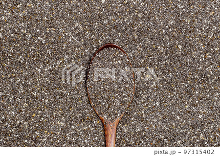 Healthy breakfast, Chia seeds in wooden spoon on chia seeds or superfood background 97315402